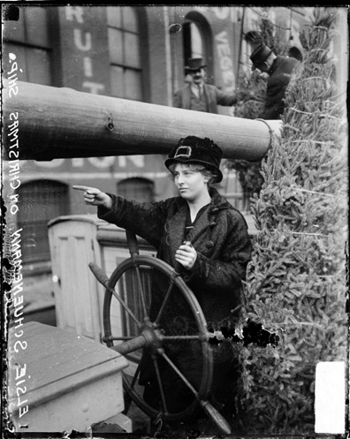 Elsie Schuenemann at the helm of the Christmas Tree Ship
