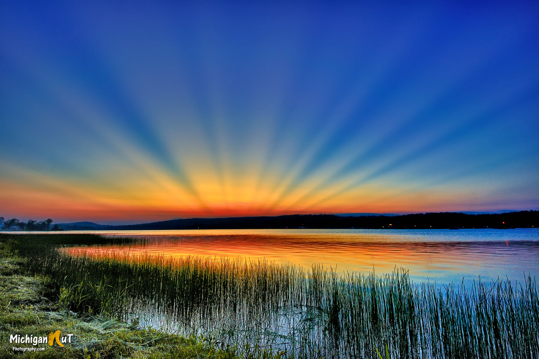 Crepuscular rays over Sunday Lake by Michigan Nut Photography